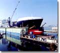The freshly painted Midnight Sun receives some finishing touches in NASSCO's drydock.