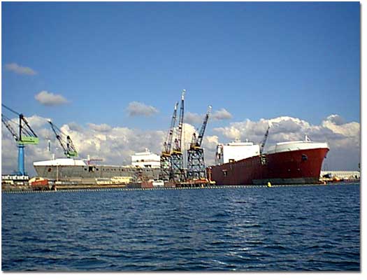 A photographer on a boat in&nbsp;San Diego Bay has captured "Twin TOTEs," with construction on the M.V. Midnight Sun (r) continuing dockside and construction on the M.V. North Star (l) in NASSCO's drydock.  The North Star is being prepared to be floated out to join her sister ship in the Bay.