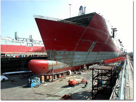 The bow of the ship is completed in anticipation of the ship's float out from NASSCO's graving dock