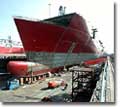 The bow of the ship is completed in anticipation of the ship's float out from NASSCO's graving dock